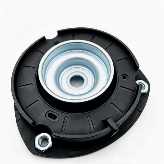 Front strut mount assembly with black housing and exposed silver metal center plate