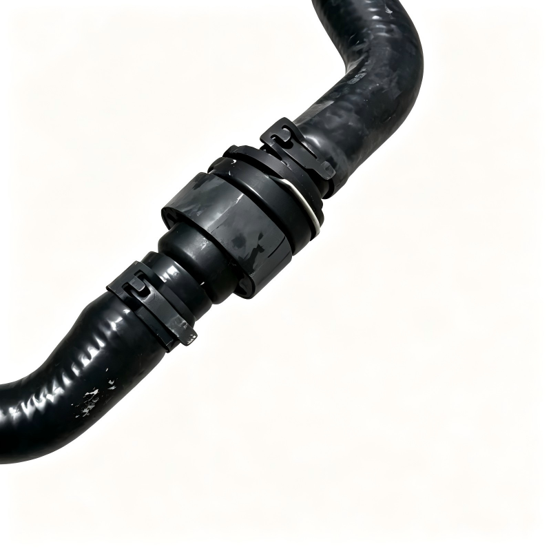 Engine coolant pipe hose coupling with black rubber hoses and metal clamp rings