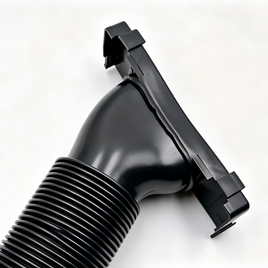 Black molded air intake hose with corrugated section and mounting clamp tabs