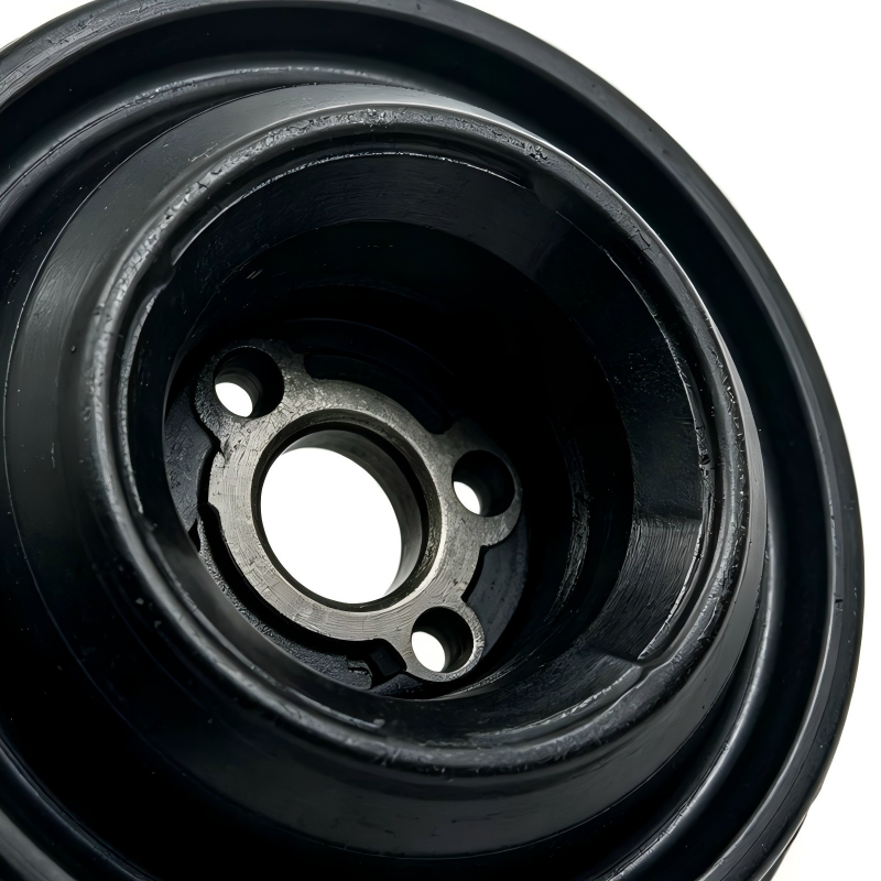 Suspension rubber mount close-up showing inner metal ring and three bolt holes