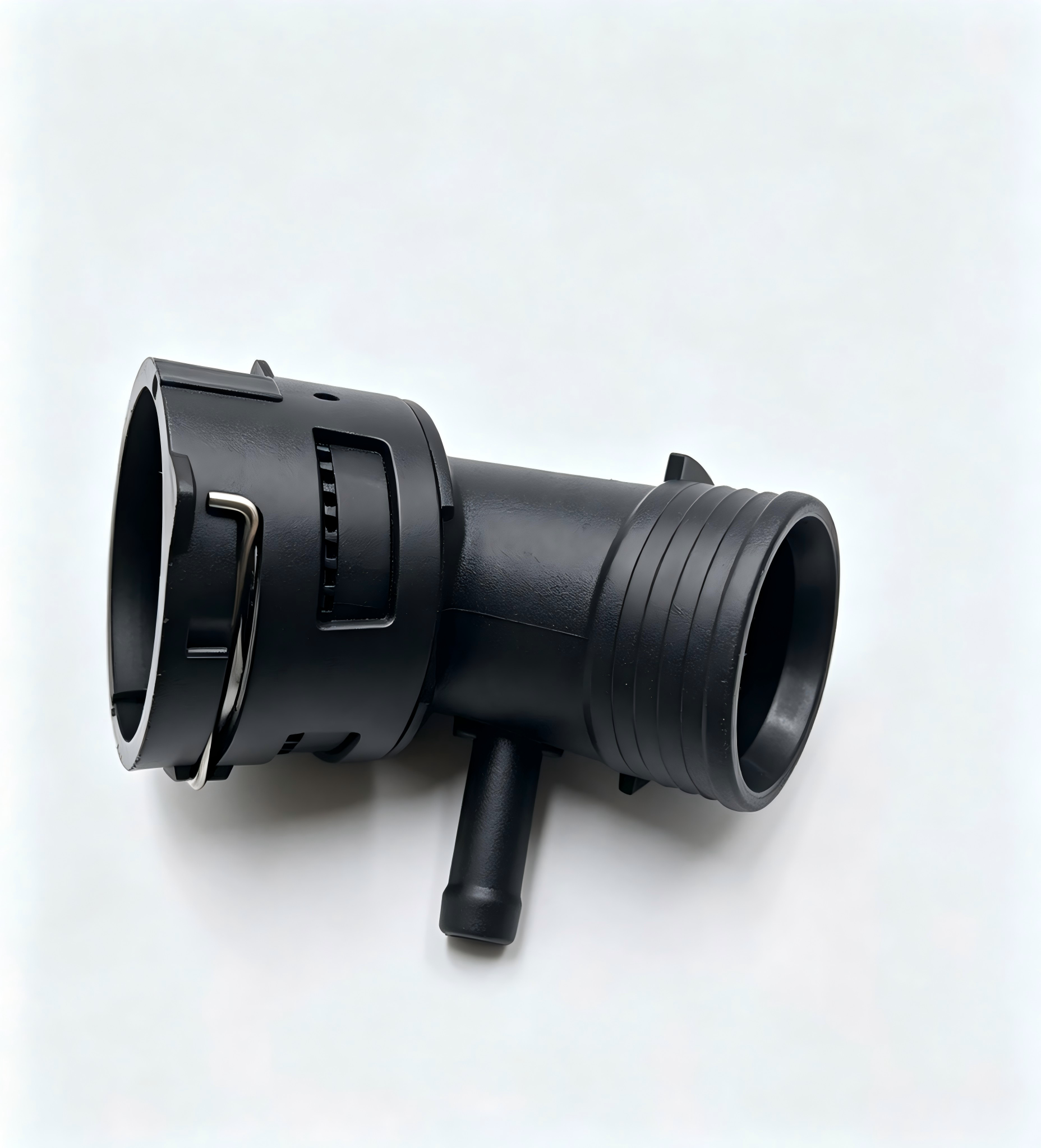 Black coolant hose connector with flanged inlet, ribbed hose end, and side outlet