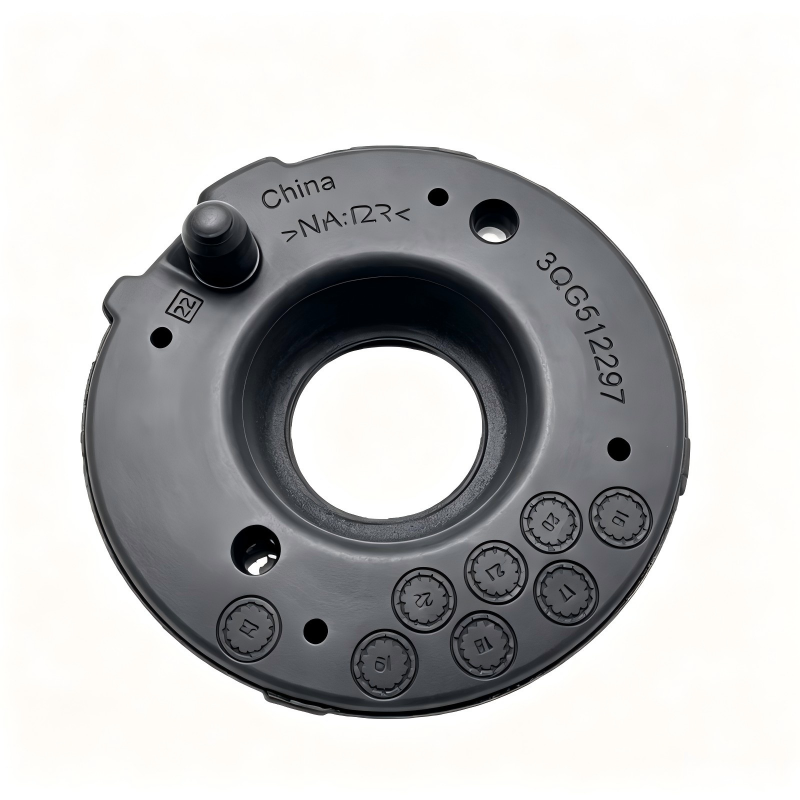 Automotive coil spring pad, black circular insulator with central hole and mounting holes