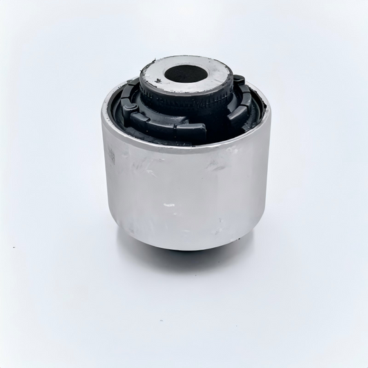 Control arm bushing: silver metal sleeve with black rubber inserts and center hole