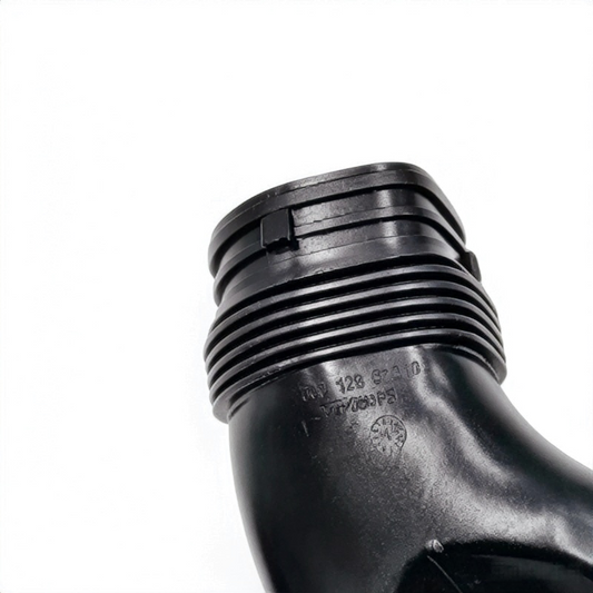 Black rubber air intake hose with ribbed threads and molded markings near connector
