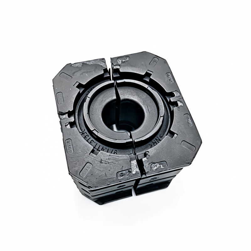 Black stabilizer bar bushing bracket with circular bore and inner sleeve