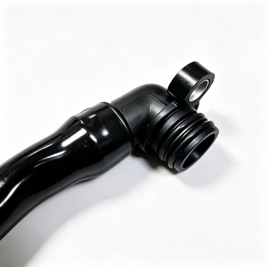 Black crankcase breather hose with corrugated connector and flanged vent end, close-up