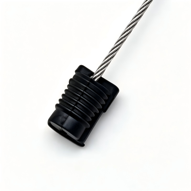 Black cable end cover with braided metal cable for door lock mechanism