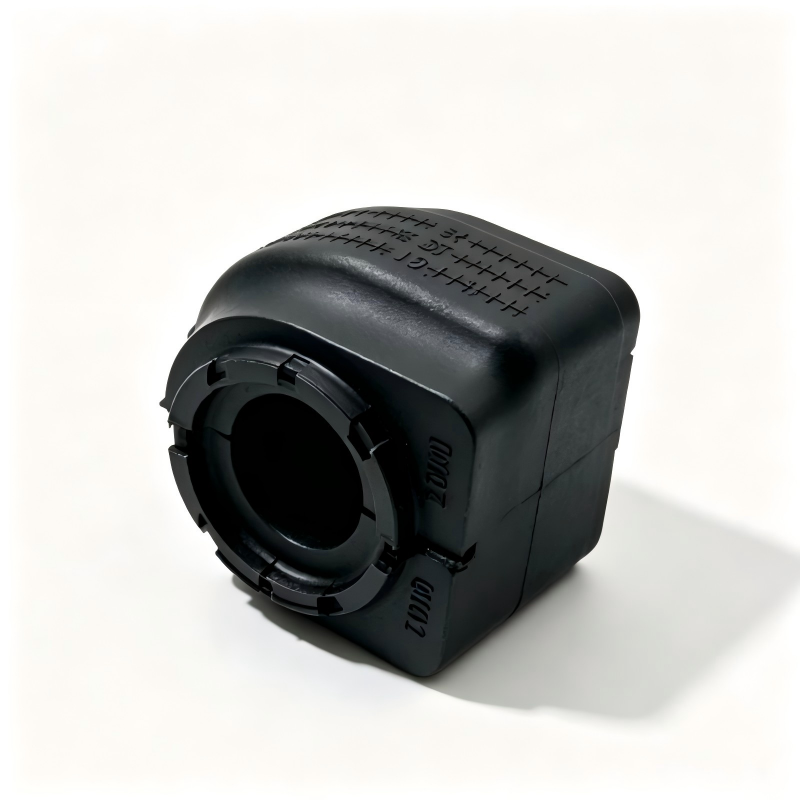 Front stabilizer bar bushing, black rubber block with textured top and circular end