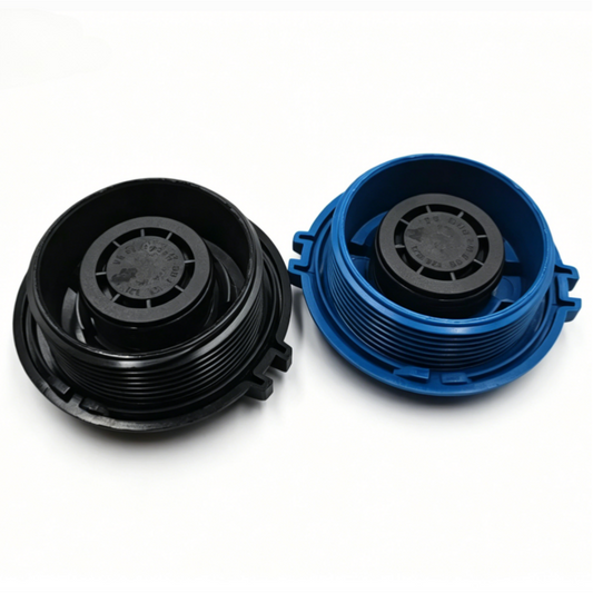 Coolant reservoir caps, one black and one blue, shown open with inner threads