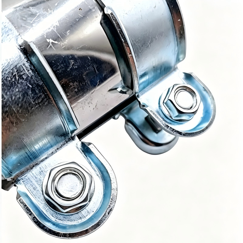 Close-up exhaust clamp with nut-and-bolt bracket on galvanized steel band