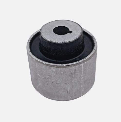 Control arm bushing with black rubber insert and metal housing, round shape.