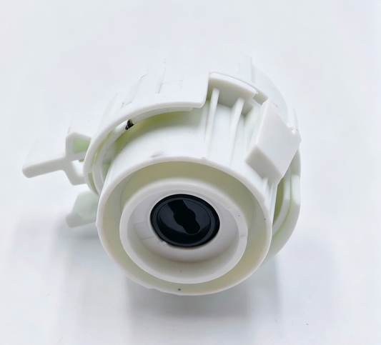 White ignition switch housing with round black socket and mounting tabs