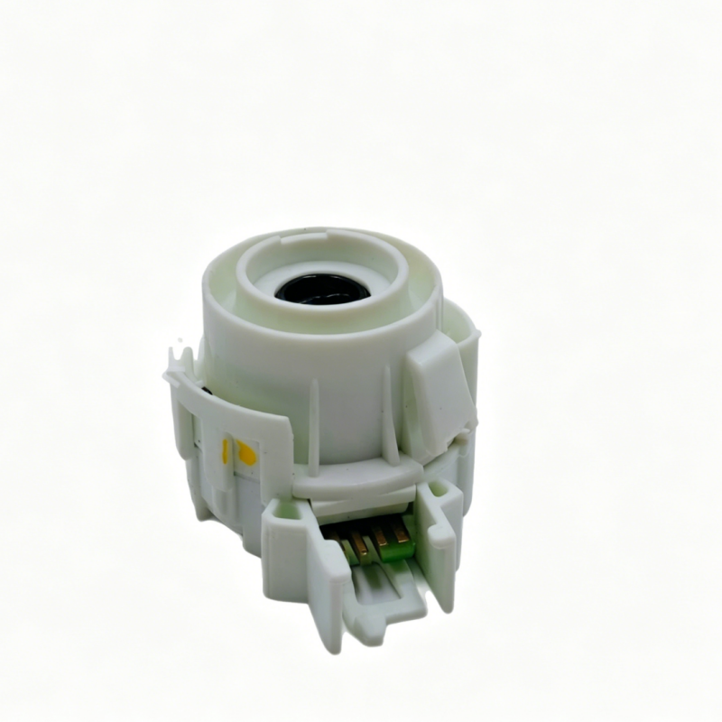 White ignition switch component with circular opening and green terminal contacts