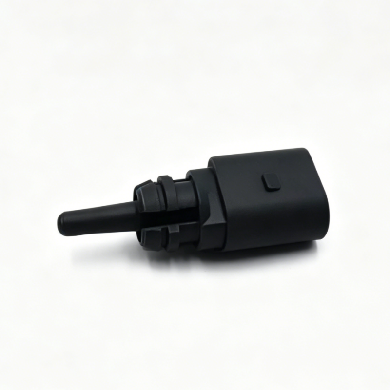 Black sensor connector with two-part plug and protruding metal pin