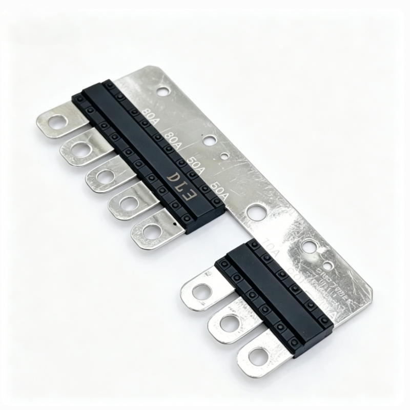 Multi fuse strip with black fuse blocks on silver metal, angled row of terminal tabs.