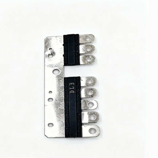 Multi fuse strip plate with black fuse blocks and five metal terminal prongs.
