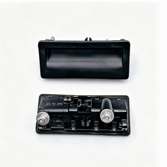 Black tailgate handle housing with release opening and internal latch mechanism