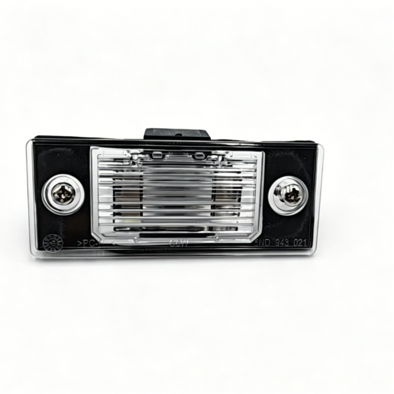 Black license plate light assembly with chrome lens grille and two mounting screws