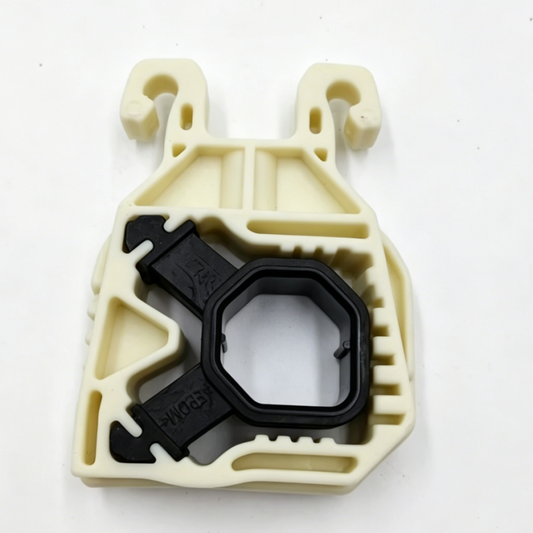 Beige plastic radiator support bracket with black mounting insert