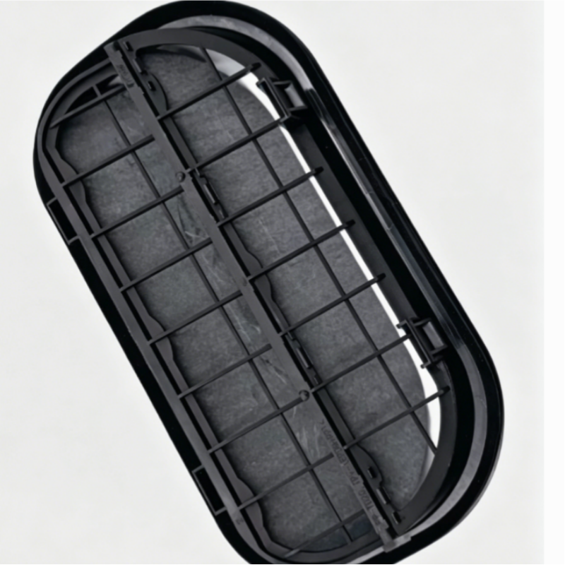 Black rear bumper air vent grille insert with vertical bars and mounting tabs