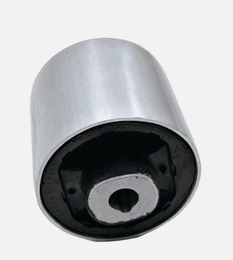 Metal control arm bushing with black rubber insert and center hole, close-up view