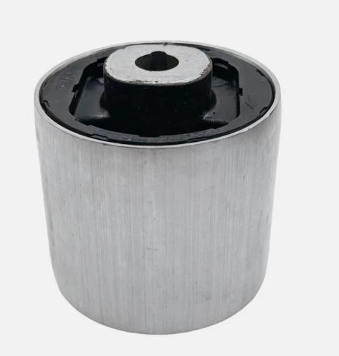 Cylindrical metal control arm bushing with black rubber core and top metal plate