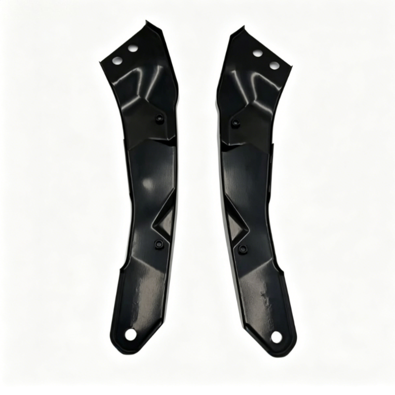 Pair of black headlight mounting brackets with bolt holes