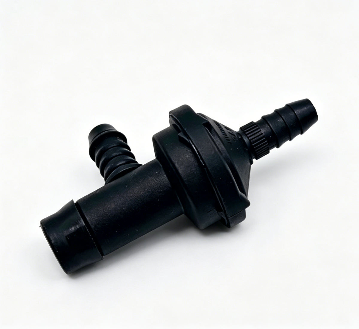 Black vacuum check valve with molded hose connections, angled view