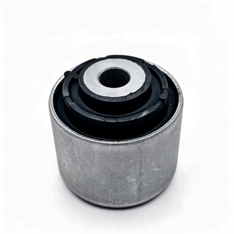 Control arm bushing showing gray outer sleeve and black rubber mount with center hole