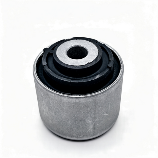 Control arm bushing showing gray outer sleeve and black rubber mount with center hole