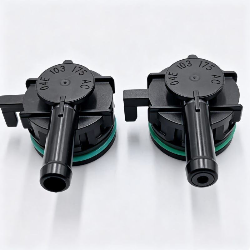 Crankcase ventilation valve pair, black housings with green ring and metal spout outlets