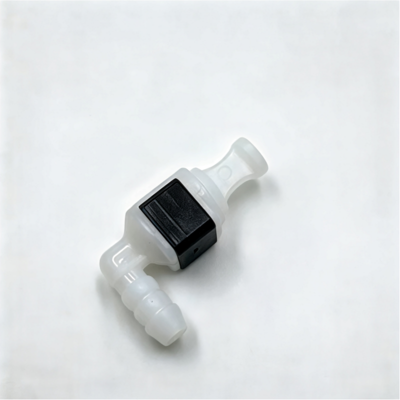 White coolant hose connector with black square insert, angled close-up