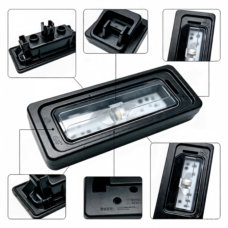 License plate light housing with clear lens and mounting base shown