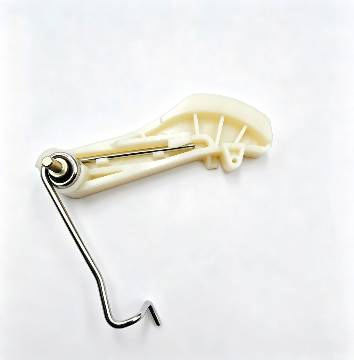 Timing chain tensioner with cream plastic guide and L-shaped metal crank.