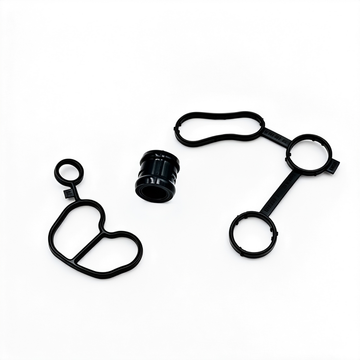 Engine oil cooler gasket kit with multiple black rubber seals, O-rings, and sleeve
