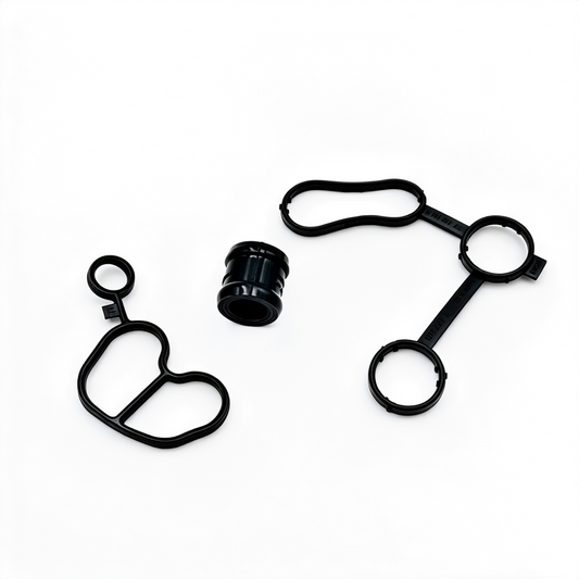 Engine oil cooler gasket kit with multiple black rubber seals, O-rings, and sleeve