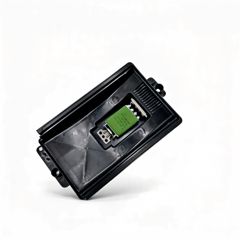 Blower motor resistor module in black housing with green circuit board detail