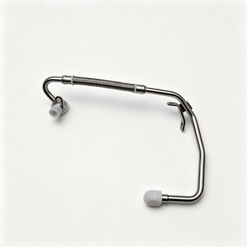 Turbo boost pipe assembly with braided section, curved metal tubes, and two mounting ports