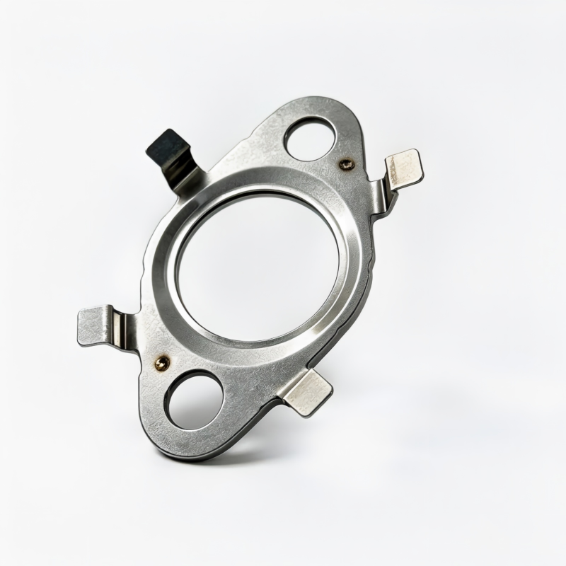 Metal oil line seal with central circular opening and side mounting tabs