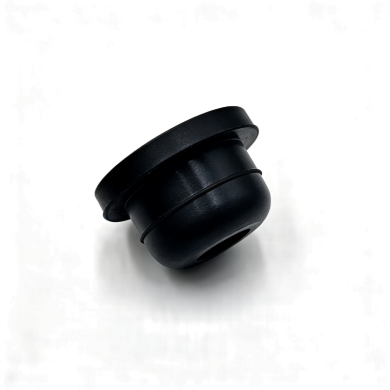 Black rubber washer pump seal with wide flange and central opening, angled view