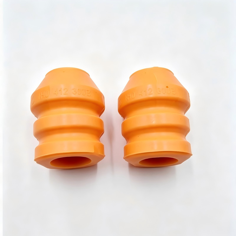Pair of orange front shock absorber bump stops with top openings, stamped 1H0412303B