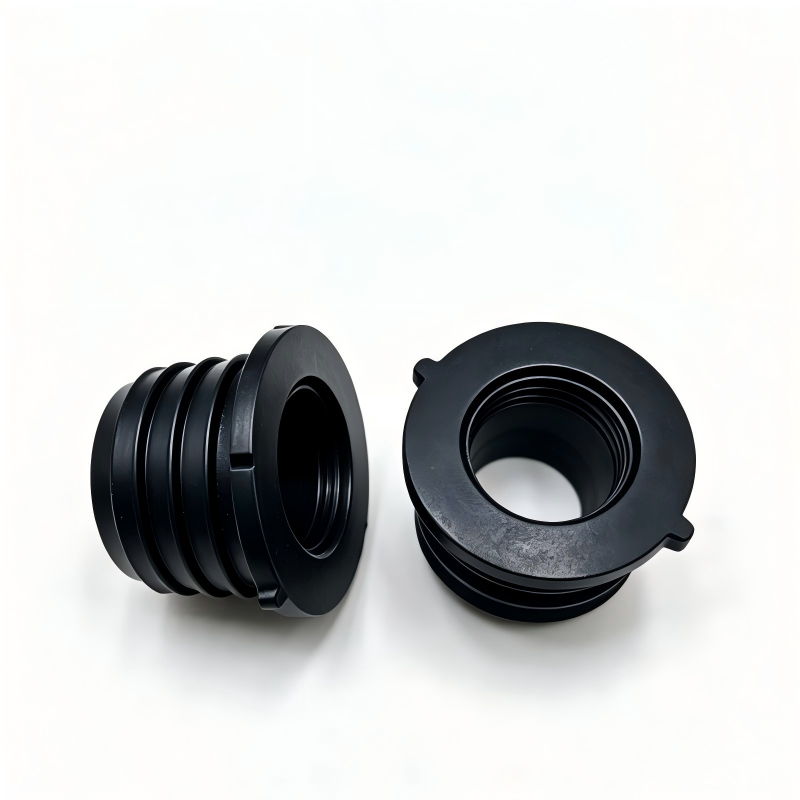 Pair of black EVAP canister seals with circular opening and mounting tabs